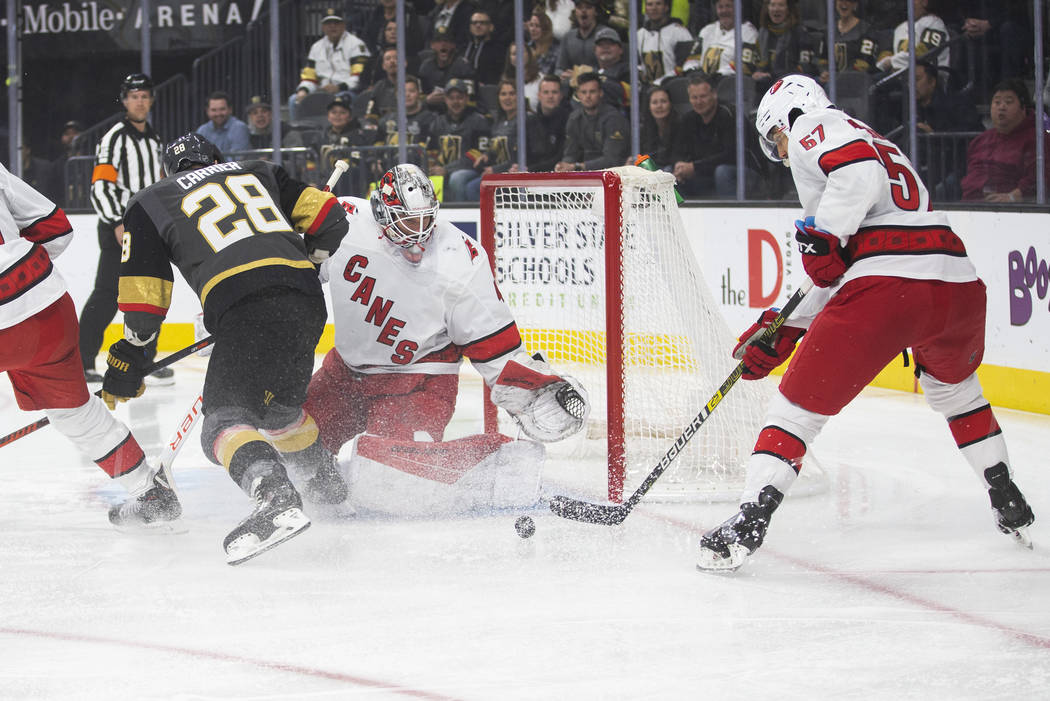 Vegas Golden Knights left wing William Carrier (28) shoots on Carolina Hurricanes goaltender Ja ...