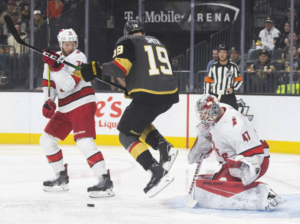 Vegas Golden Knights right wing Reilly Smith (19) tries to redirect a puck past Carolina Hurric ...