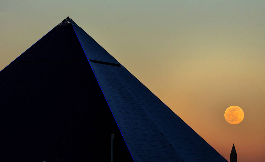 The Snow Moon rises behind the Luxor on Saturday, Feb. 8, 2020, in Las Vegas. (L.E. Baskow/Las ...