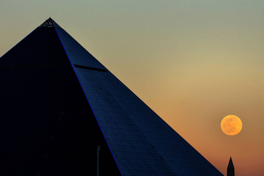The Snow Moon rises behind the Luxor on Saturday, Feb. 8, 2020, in Las Vegas. (L.E. Baskow/Las ...