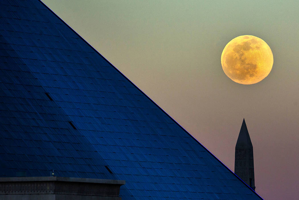 The Snow Moon rises behind the Luxor on Saturday, Feb. 8, 2020, in Las Vegas. (L.E. Baskow/Las ...