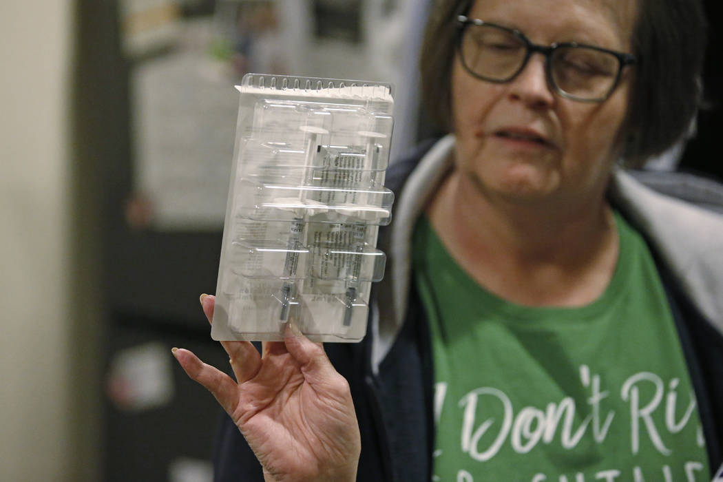 Ann Lovell holds her prescriptions at her home in South Jordan, Utah, on Jan. 31, 2020. (AP Pho ...