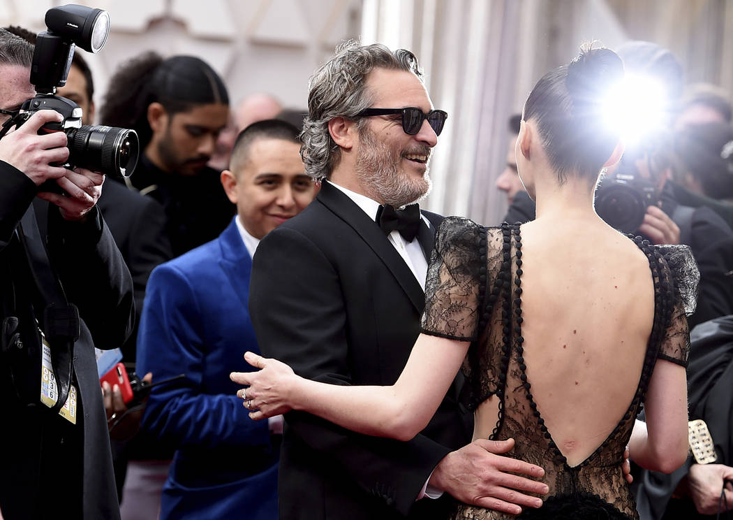 Joaquin Phoenix, left, and Rooney Mara arrive at the Oscars on Sunday, Feb. 9, 2020, at the Dol ...