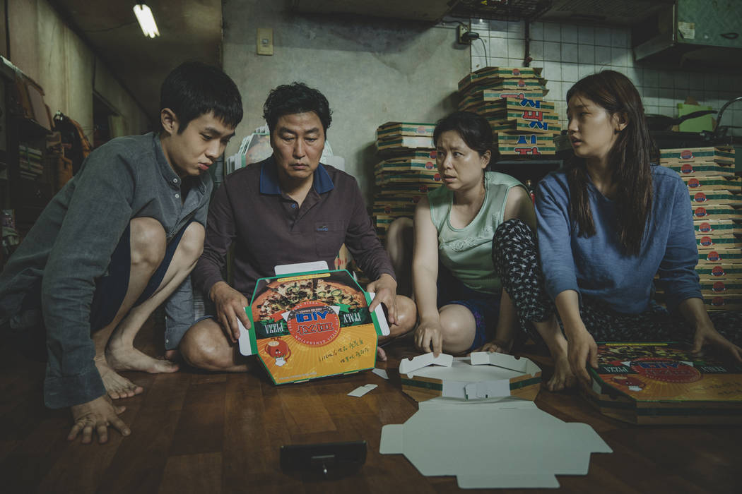 This image released by Neon shows Woo-sik Choi, from left, Kang-ho Song, Hye-jin Jang and So-da ...