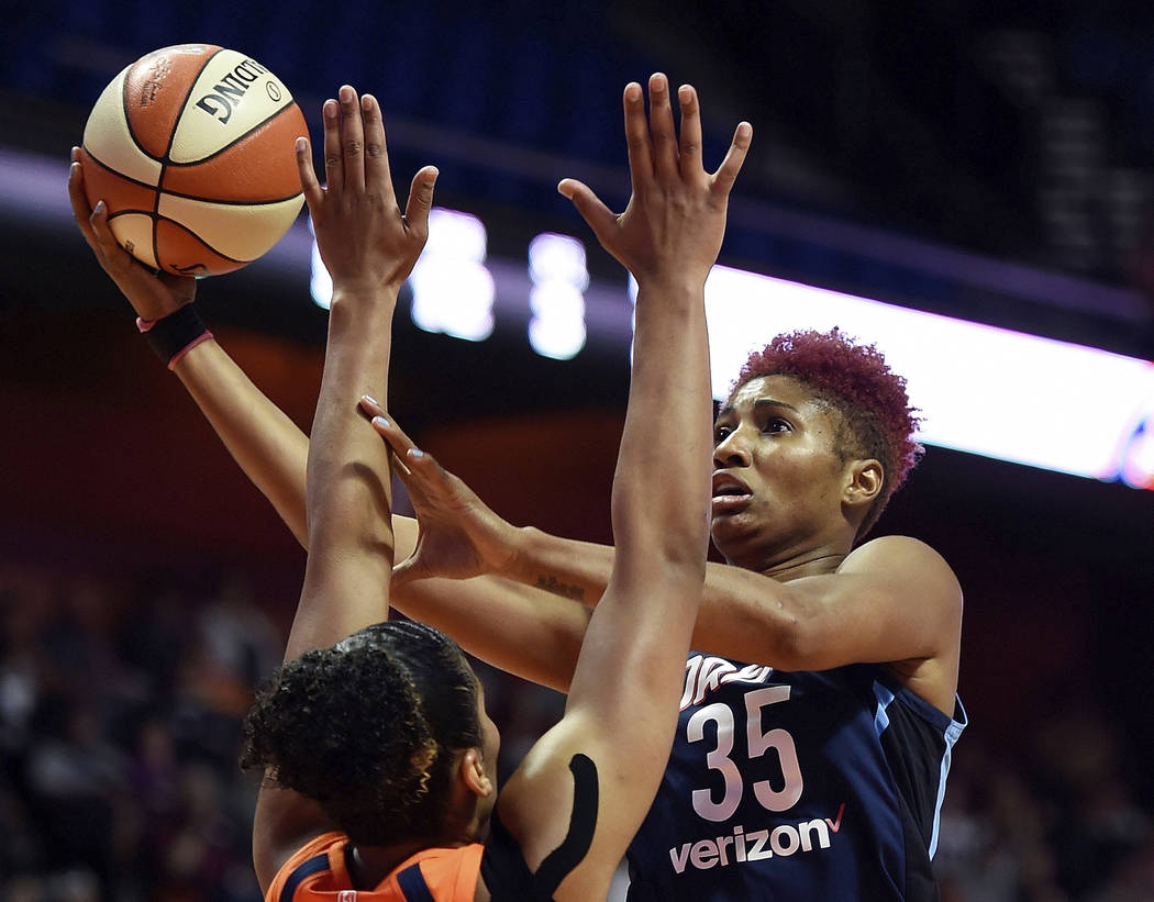 FILE - In this July 17, 2018, file photo, Atlanta Dream forward Angel McCoughtry shoots over Co ...