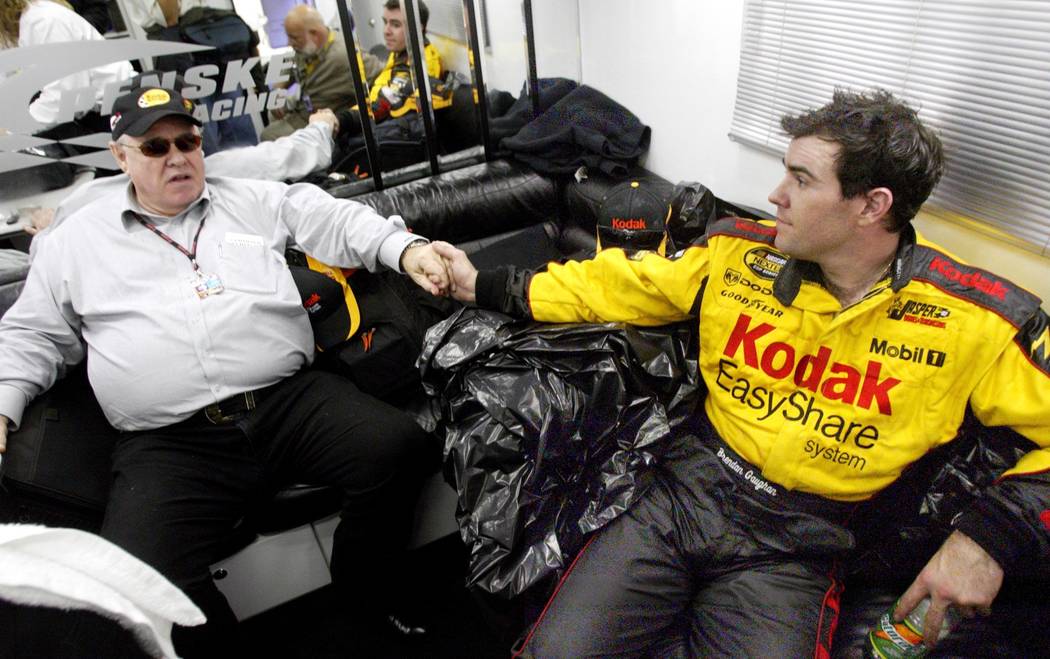Las Vegan Brendan Gaughan rests in his car-hauler with his father Michael after finishing his f ...