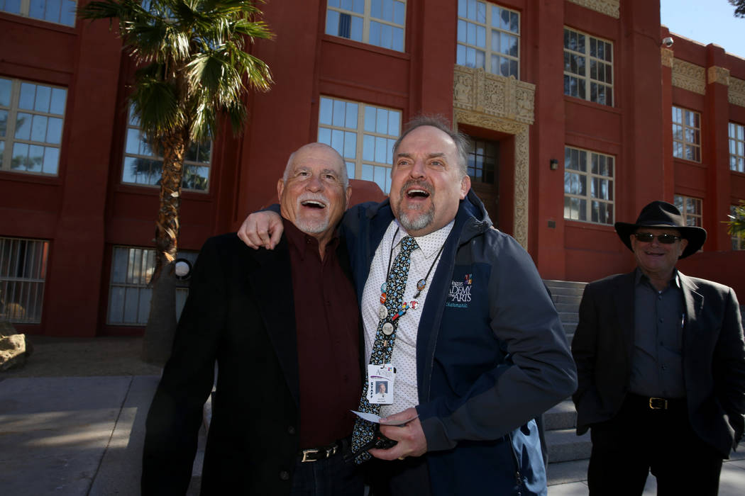 Las Vegas Academy principal Scott Walker, right, thanks class of 1968 alumnus Allen Kaercher fo ...
