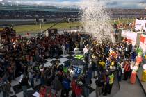 Jimmie Johnson celebrates in victory lane after winning the NASCAR Nextel Cup UAW-DaimlerChrysl ...