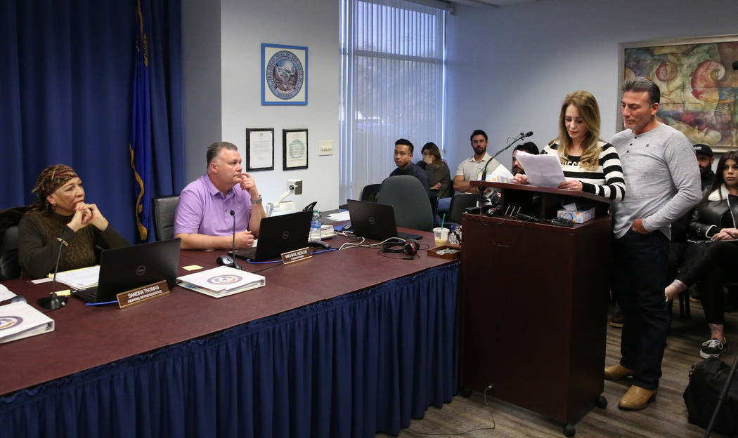 Joyce Garibay, second right, mother of 45-year-old Luis Campos, reads her statement to parole b ...