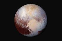 This 2015 image shows a combination of images captured by the New Horizons spacecraft with enha ...