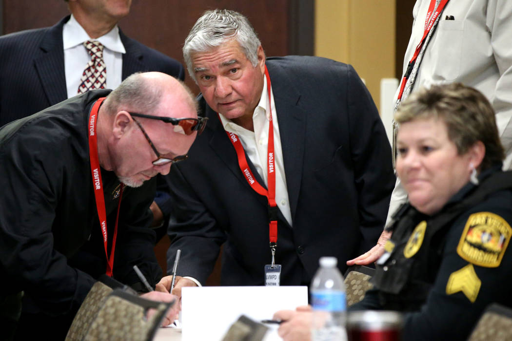 Former Henderson Constable Earl Mitchell, center, attemds a State of Nevada Commission on Peace ...