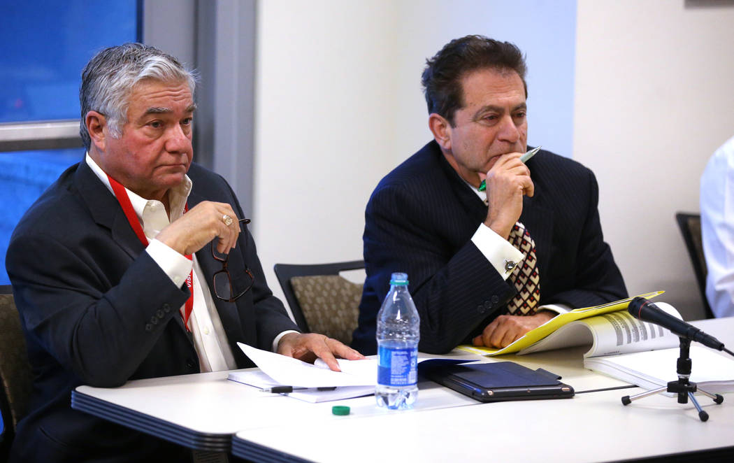 Former Henderson Constable Earl Mitchell, left, and his attorney Marc Risman listen to testimon ...