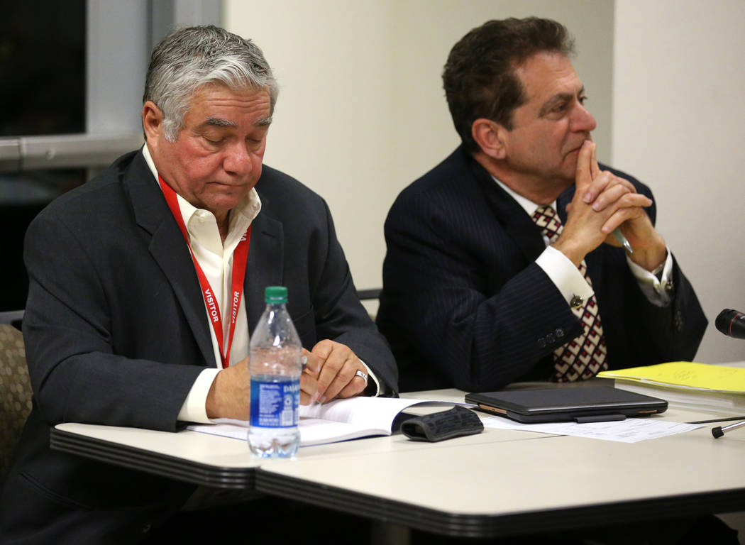 Former Henderson Constable Earl Mitchell, left, and his attorney Marc Risman reacts to the Stat ...