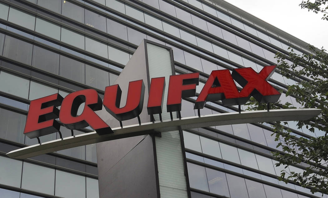 FILE - This July 21, 2012, file photo shows signage at the corporate headquarters of Equifax In ...