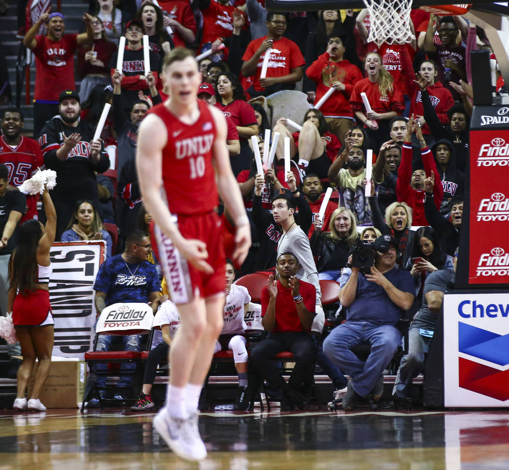 UNLV's Jonah Antonio (10) celebrates his three-pointer against UNR during the first half of a b ...