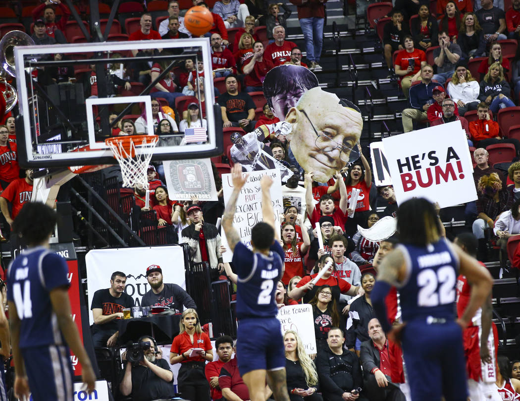 UNLV fans try to distract UNR's Jalen Harris (2) as he attempts a free throw during the second ...