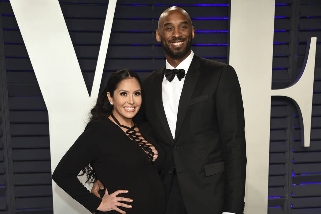 FILE - This Feb. 24, 2019 file photo shows Kobe Bryant, right, and Vanessa Laine Bryant at the ...