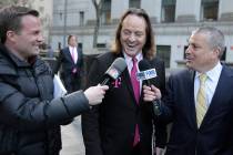 In a Jan. 15, 2020, file photo T-Mobile chief executive John Legere speaks to reporters as he l ...