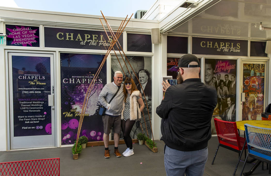 Patrick Conlin, left, stands with Sophie Prydderch under and arch as Lumston, all of Whales, ta ...