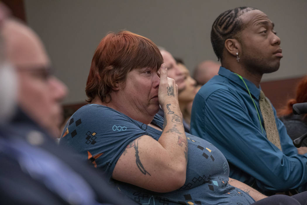 Displaced Alpine Motel Apartments tenants Sandi Jones, left, and Timothy Henry listen to the ju ...