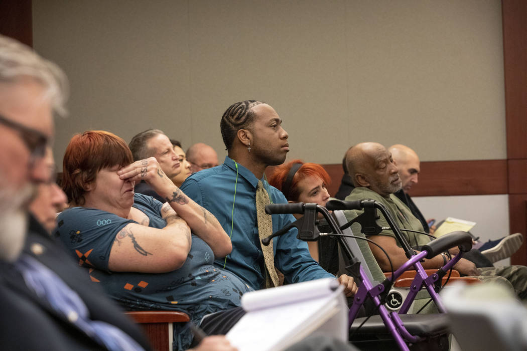 Displaced Alpine Motel Apartments tenants listen as the judge speaks to the civil attorney for ...