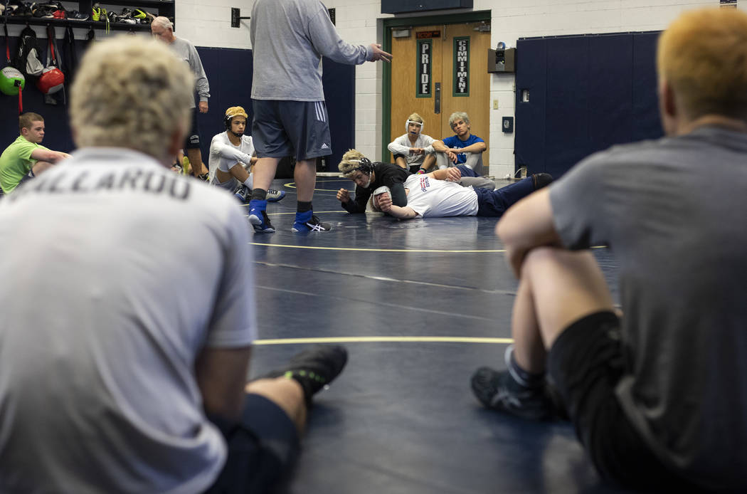 The Shadow Ridge High School wrestling team practices for the last time before the class 4A sta ...
