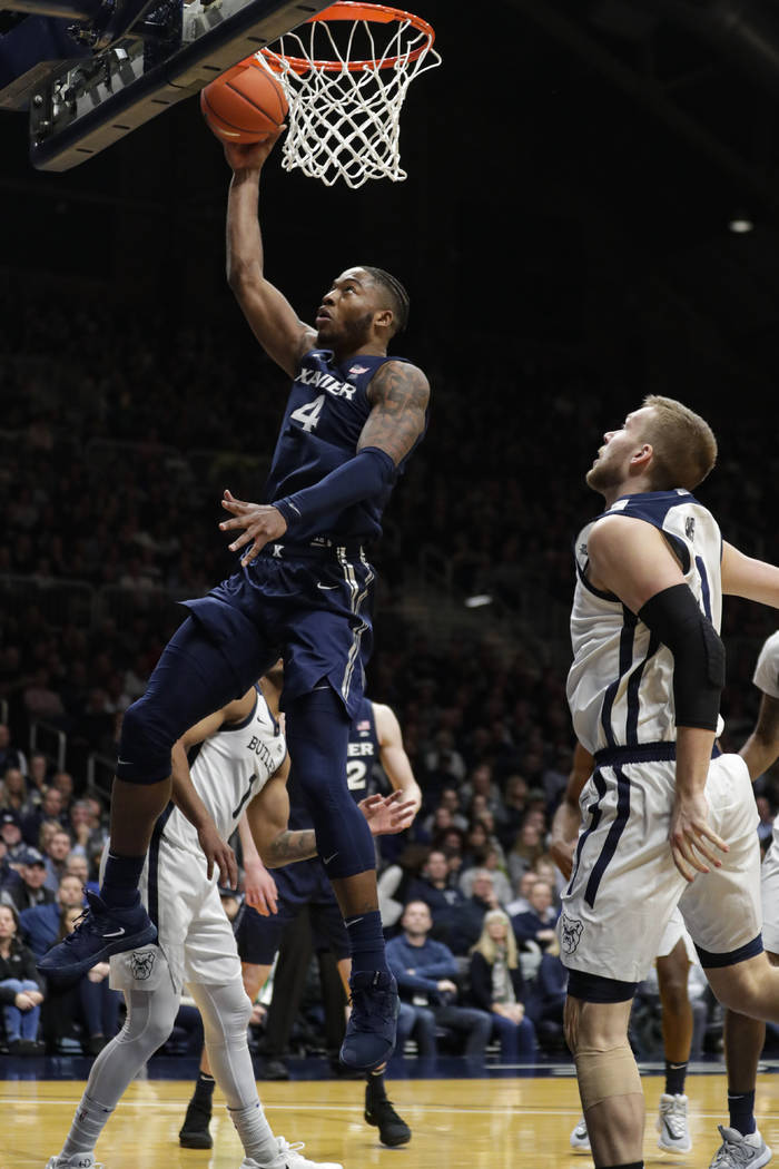 Xavier forward Tyrique Jones (4) shoots under Butler forward Sean McDermott (22) in the second ...