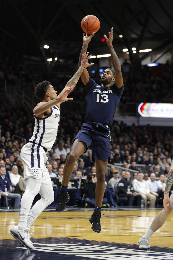 Xavier forward Naji Marshall (13) shoots over Butler forward Jordan Tucker (1) in the second ha ...