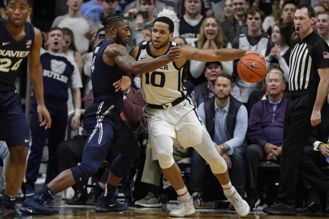 Butler forward Bryce Nze (10) drives on Xavier forward Tyrique Jones (4) in the second half of ...