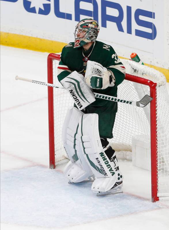 Minnesota Wild's Alex Stalock hits his hockey stick against the post as he celebrates his 4-0 s ...