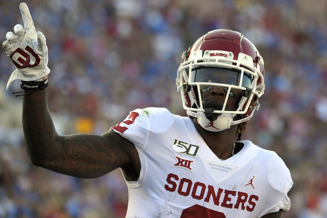 FILE - In this Sept. 14, 2019, file photo, Oklahoma wide receiver CeeDee Lamb celebrates after ...