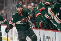Minnesota Wild defenseman Mathew Dumba celebrates with the bench after scoring a goal against t ...
