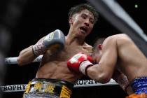 Japan's Naoya Inoue, left, sends a left to Philippines' Nonito Donaire in the 11th round of the ...