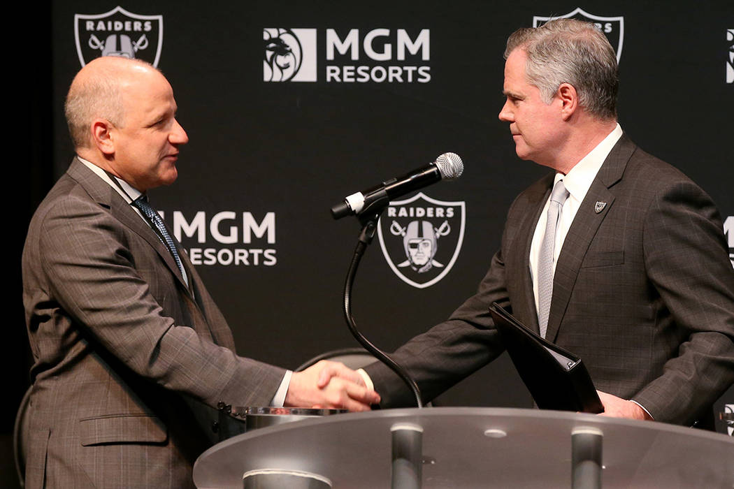 Raiders president Marc Badain, left, and Jim Murren, MGM Resorts CEO and chairman, announce a p ...