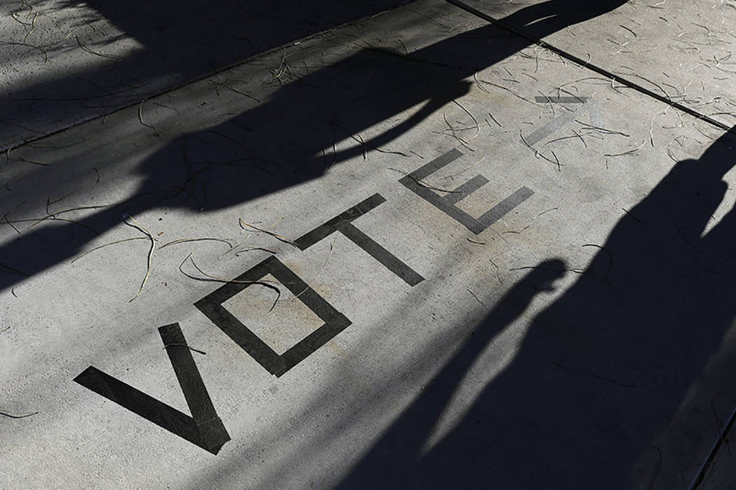 Voters head to the polls at the Enterprise Library in Las Vegas in November 2018. (AP Photo/Joe ...