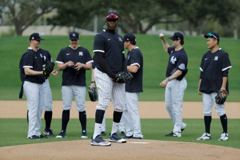 New York Yankees' Aroldis Chapman takes part in drills with teammates during spring training ba ...