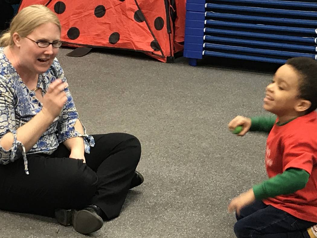 Emily Rawlings with Dynamic Music Therapy leads preschoolers during a music therapy session as ...