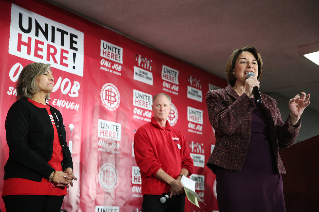 Democratic presidential candidate Amy Klobuchar, center, with Geoconda Arguello-Kline, left, se ...