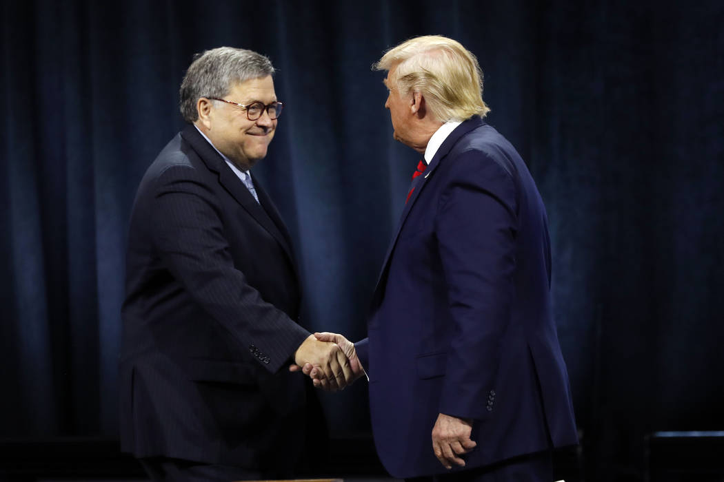 FILE - In this Oct. 28, 2019, file photo, President Donald Trump shakes hands with Attorney Gen ...