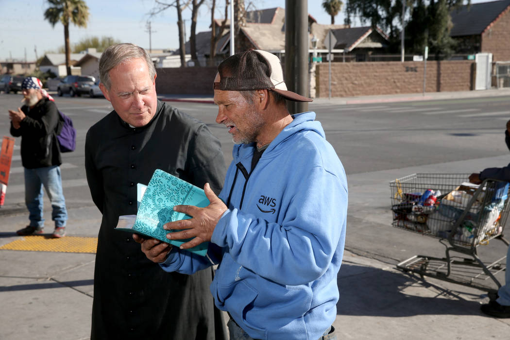 The Rev. Courtney Krier visits with Anthony De Falco, 59, during a free breakfast at St. Joseph ...