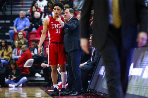 UNLV's Marvin Coleman (31) talks with UNLV's head coach T.J. Otzelberger during the first half ...