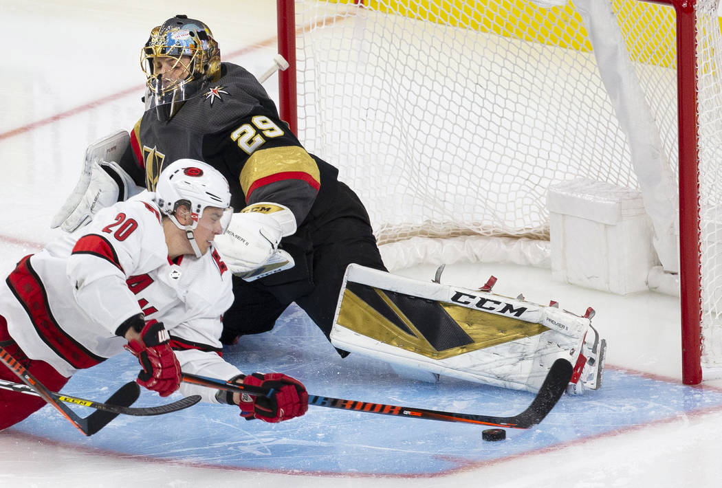 Boston Bruins goalie Tim Thomas makes a diving save as