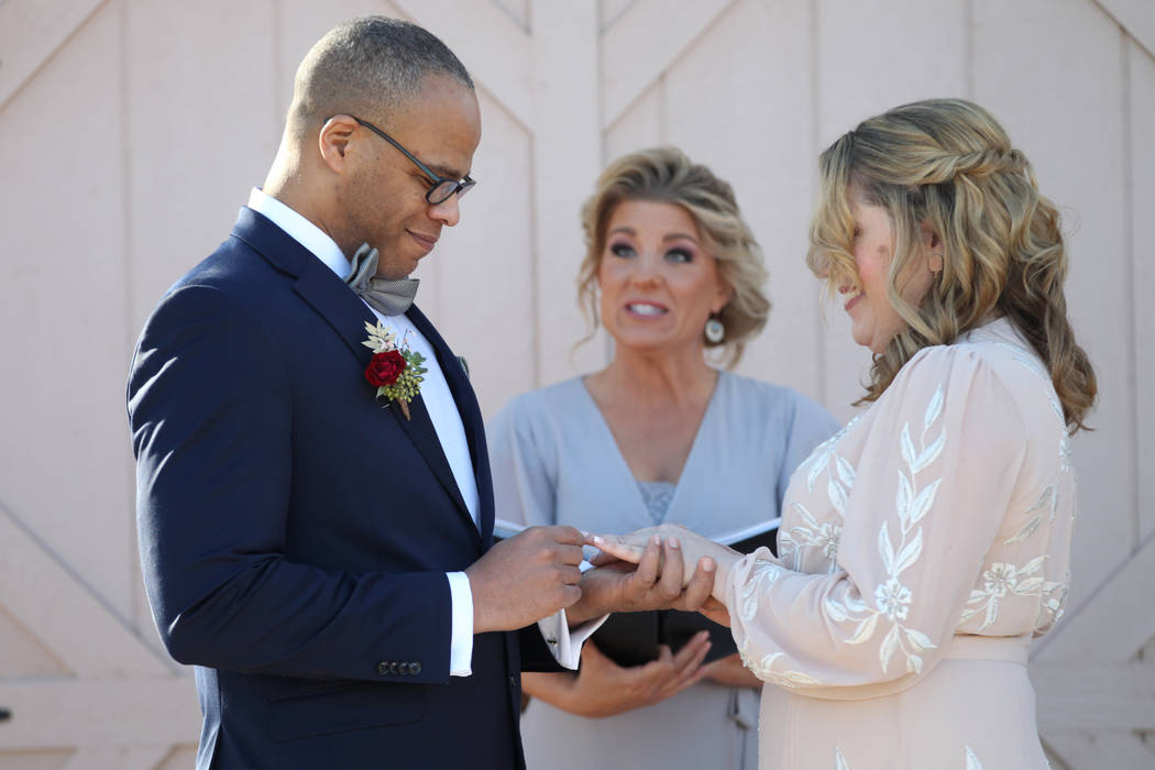 Richard Raney and Laura Eshelman of Overland Park, Kan., get married by wedding officiant Angie ...