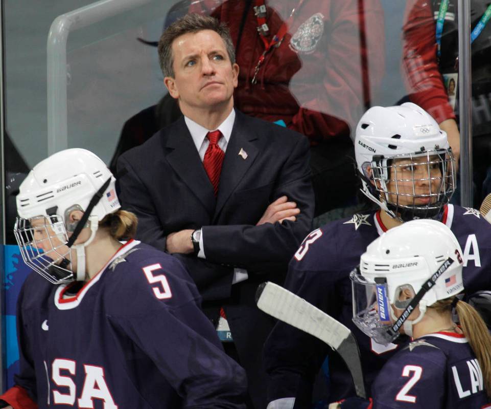 USA women's hockey head coach Mark Johnson watches his team play China in women's preliminary r ...