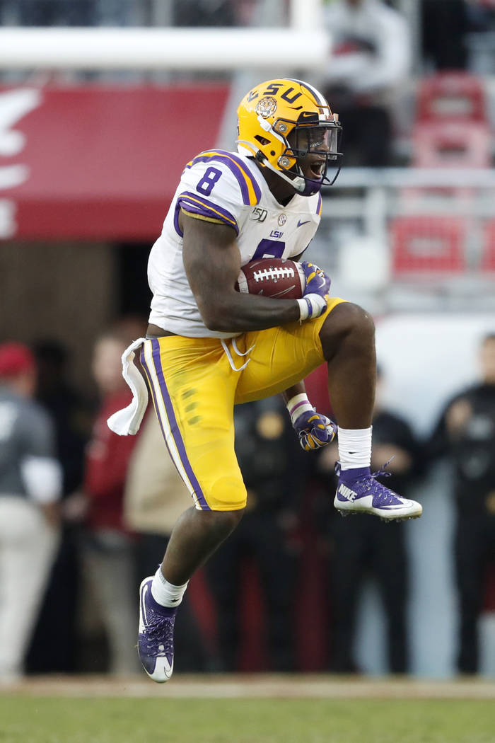 LSU linebacker Patrick Queen (8) reacts after intercepting a pass in the first half of an NCAA ...