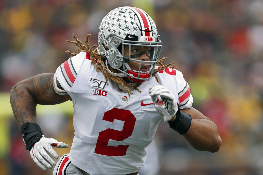 FILE - In this Nov. 30, 2019, file photo, Ohio State defensive end Chase Young plays against Mi ...