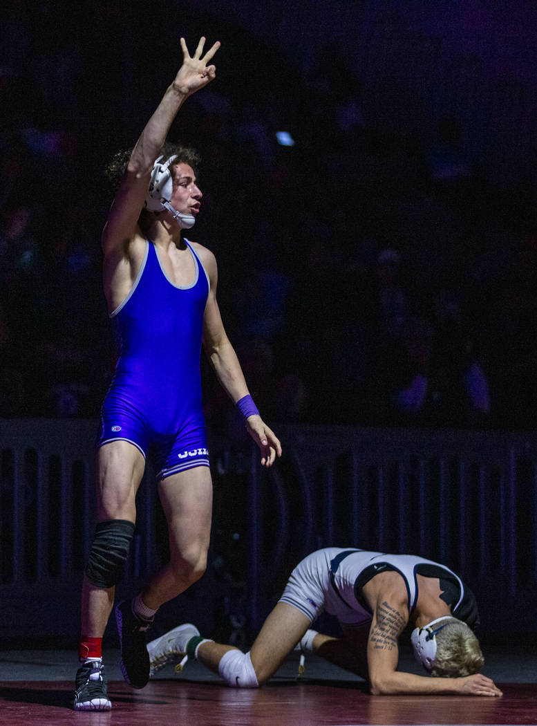 Spanish Spring's Devin Griffin, left, celebrates his win over Shadow Ridge's Matthew Van Riel i ...