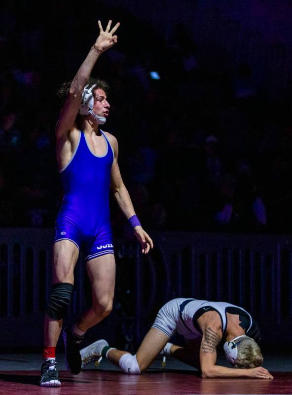 Spanish Spring's Devin Griffin, left, celebrates his win over Shadow Ridge's Matthew Van Riel i ...