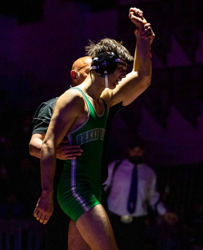 Green Valley's Caleb Uhlenhopp is awarded the win over Spanish Spring's Anthony Sissom in their ...