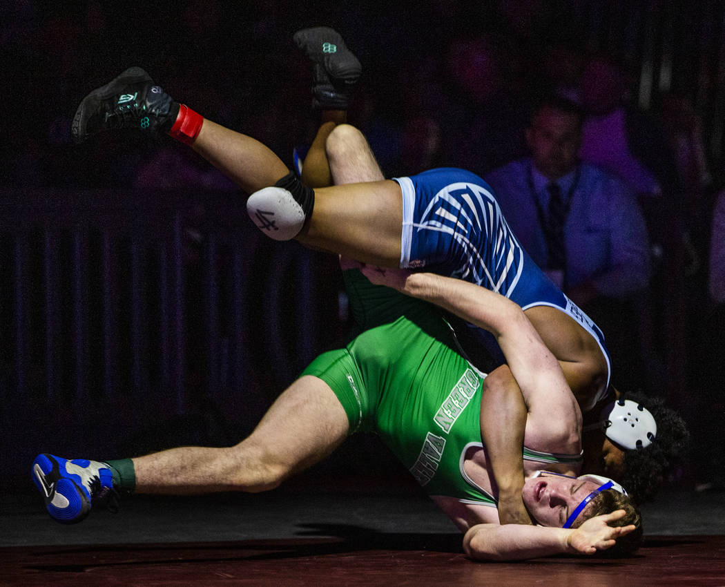 Foothill's Micah Schneider, top, drives Green Valley's Derek Recktenwald into to the mat in the ...
